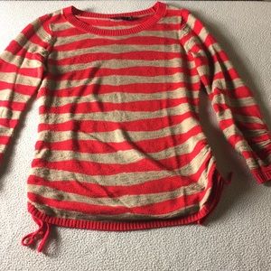 The limited small sweater with ties on sides